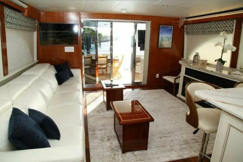 Slide: The Image of Luxurious interior of a 1998 Cheoy Lee 81 Motor Yacht with white leather seating. - 4