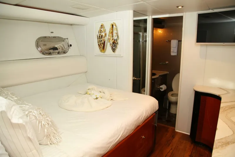 Slide: The Image of Luxurious bedroom and bathroom in a 1998 Cheoy Lee 81 Motor Yacht. - 9