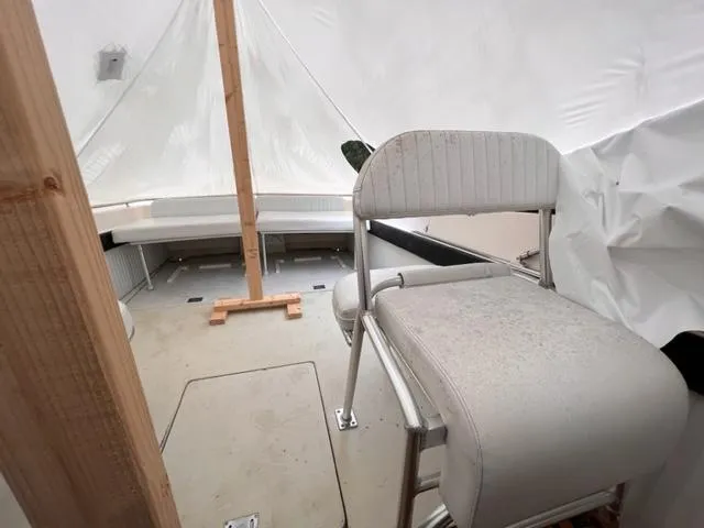 Slide: The Image of 1973 Formula Thunderbird 26 boat interior with seating and protective cover. - 10