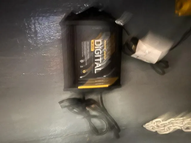 Slide: The Image of Battery charger on a Formula Thunderbird 26, 1973 model, with digital display and cables. - 13