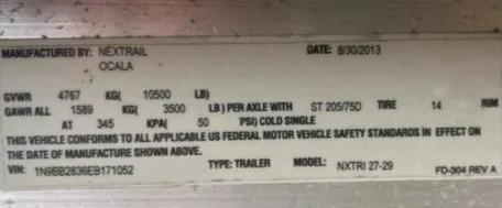 Slide: The Image of Label displaying vehicle specifications and compliance details, manufactured by Nextrail in 2013. - 14