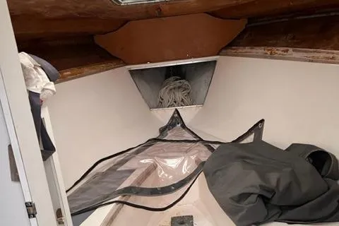 Slide: The Image of Interior of a 1973 Formula Thunderbird 26 sailboat with ropes and storage. - 7