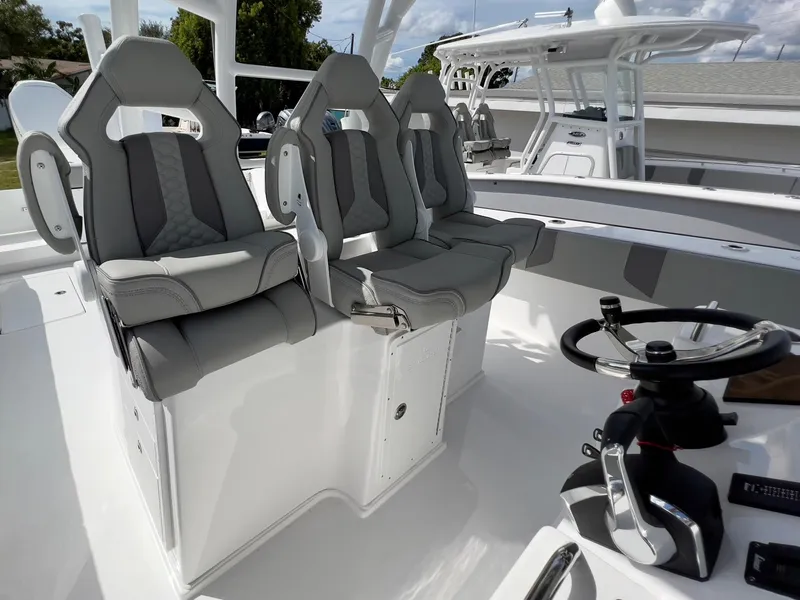 Slide: The Image of 2025 Cape Horn 39 T boat interior with modern seating and steering wheel. - 23