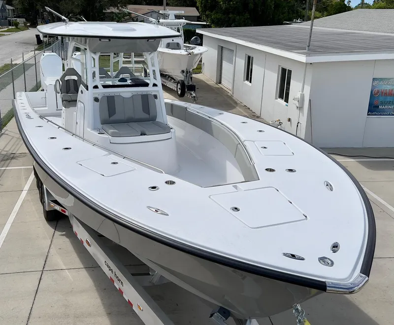 Slide: The Image of 2025 Cape Horn 39 T boat on trailer, parked near a building. - 7