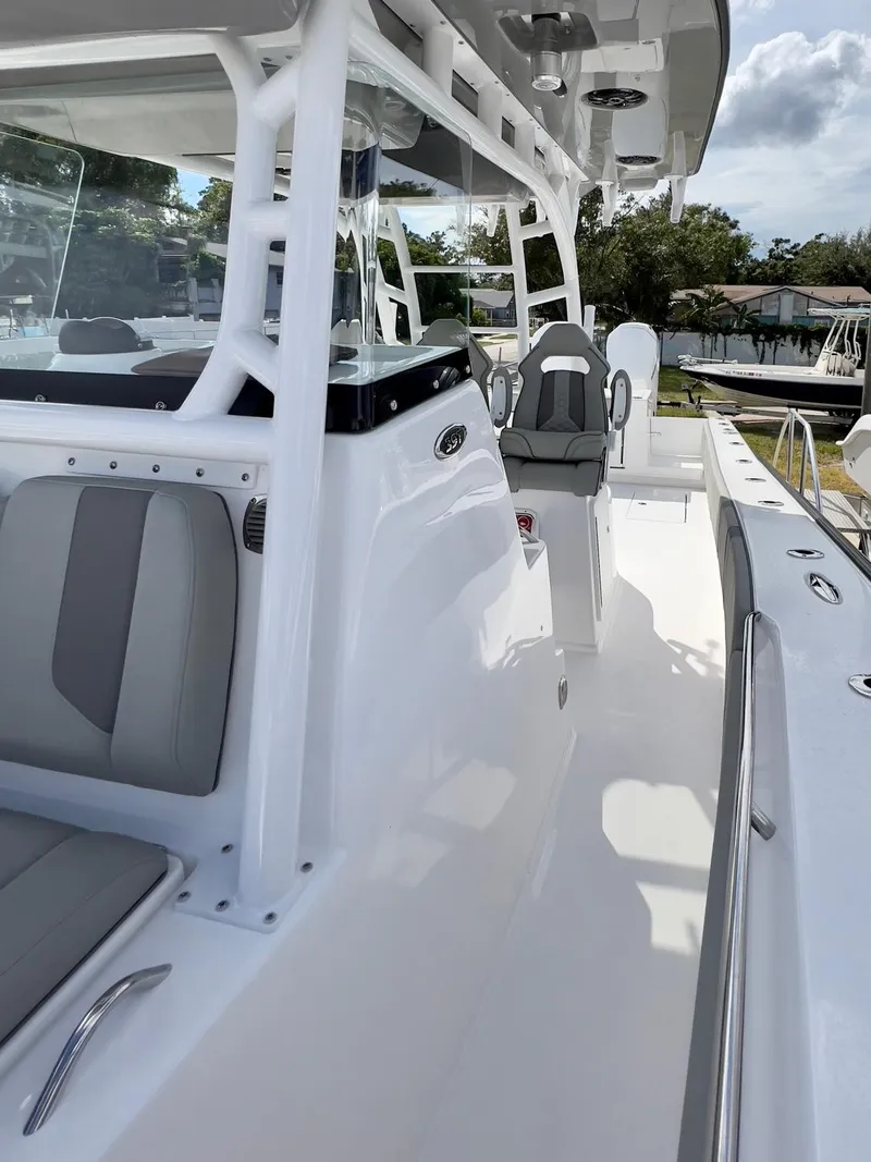 Slide: The Image of 2025 Cape Horn 39 T boat, sleek white deck, modern seating, outdoor setting. - 16