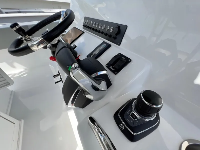 Slide: The Image of 2025 Cape Horn 39 T boat helm with steering wheel and control panel. - 22