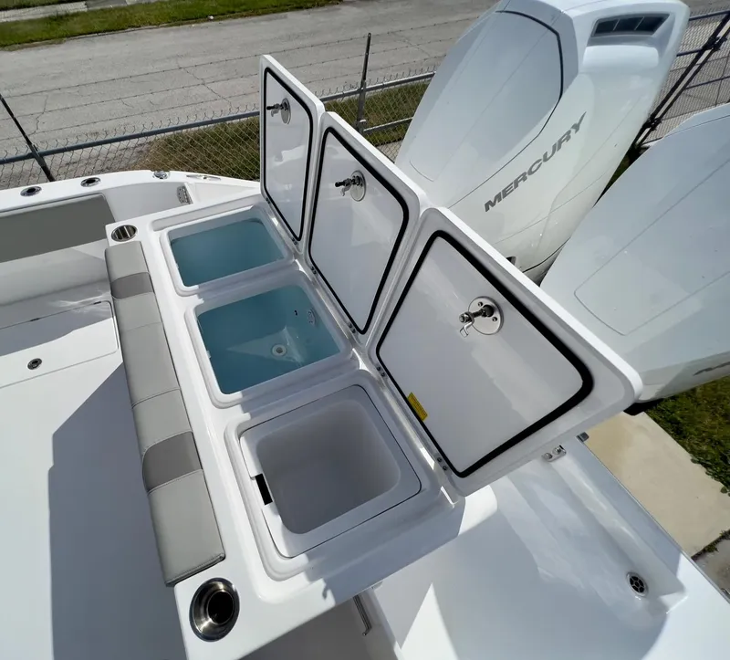 Slide: The Image of 2025 Cape Horn 39 T boat with open storage compartments and Mercury engines. - 30