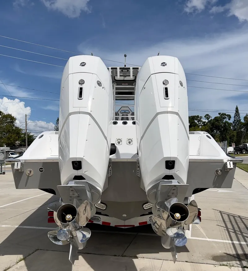 Slide: The Image of 2025 Cape Horn 39 T boat with dual outboard engines, viewed from the rear. - 4
