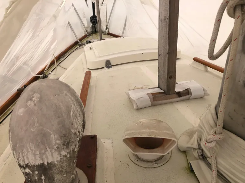 Slide: The Image of 1976 Tartan 30 sailboat deck with vintage fittings and wooden elements. - 11