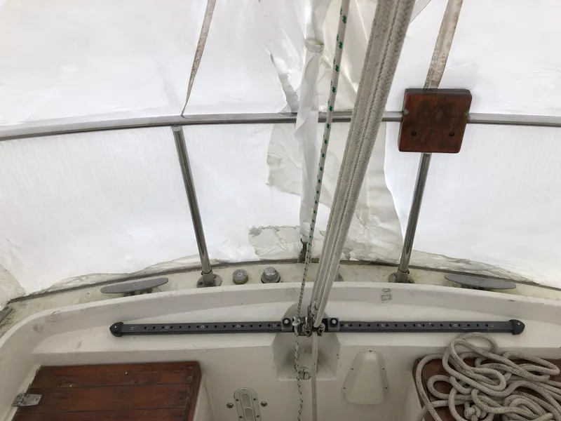 Slide: The Image of 1976 Tartan 30 sailboat cockpit with ropes and white canopy. - 15