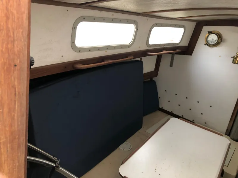Slide: The Image of Interior of a 1976 Tartan 30 sailboat with seating and portholes. - 20