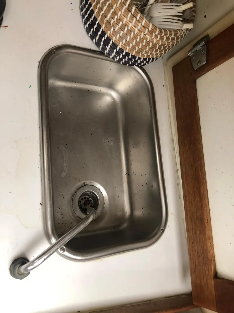 Slide: The Image of Stainless steel sink in a 1976 Tartan 30 boat interior. - 27