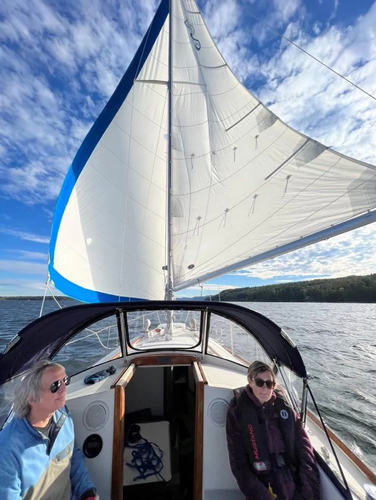 Slide: The Image of Sailing on a 1976 Tartan 30 yacht under clear blue skies. - 38