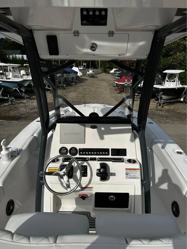 Slide: The Image of 2024 Sea Fox 248 Commander boat interior with steering wheel and control panel. - 5