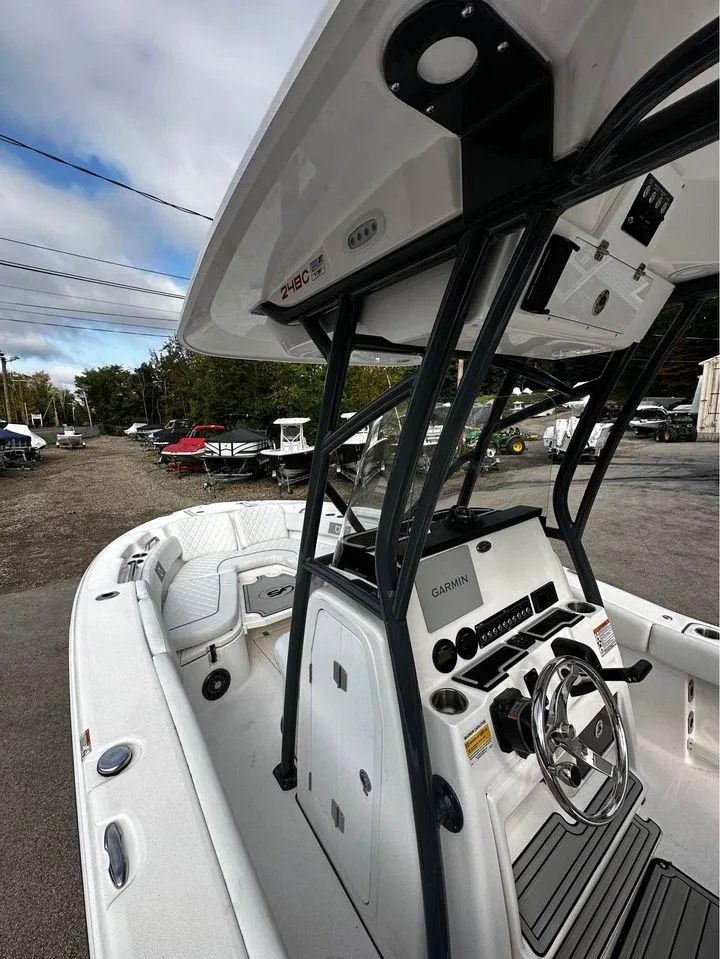 Slide: The Image of 2024 Sea Fox 248 Commander boat interior with steering console and seating. - 6