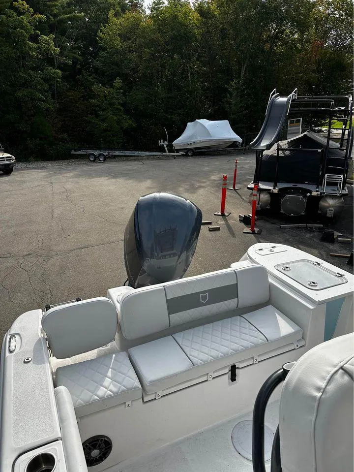 Slide: The Image of 2024 Sea Fox 248 Commander boat with sleek seating and powerful outboard motor. - 9