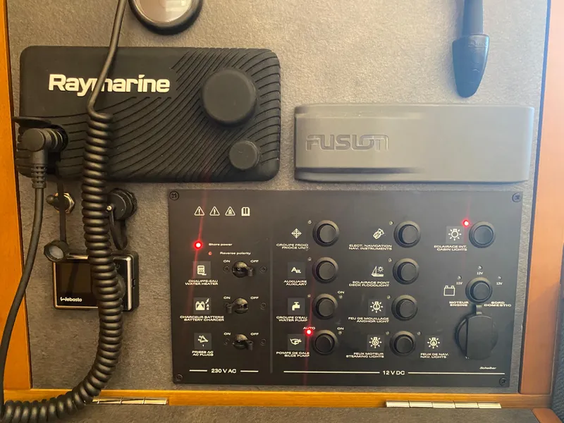 Slide: The Image of Control panel of 2023 Jeanneau Sun Odyssey 349 with Raymarine and Fusion systems. - 10