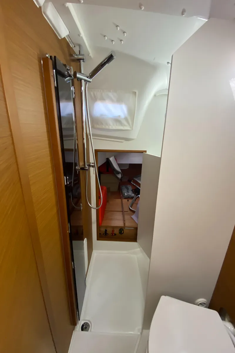 Slide: The Image of 2023 Jeanneau Sun Odyssey 349 yacht bathroom with shower and toilet. - 28