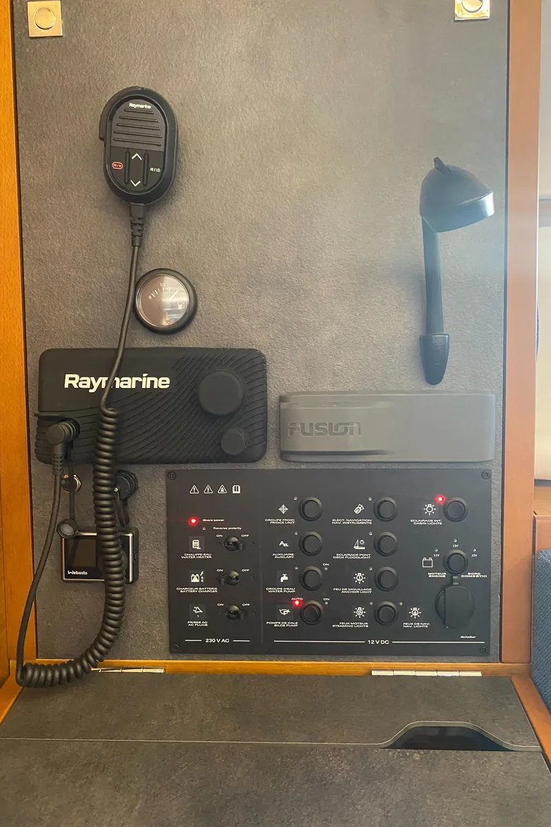 Slide: The Image of Control panel of 2023 Jeanneau Sun Odyssey 349 with Raymarine and Fusion equipment. - 9