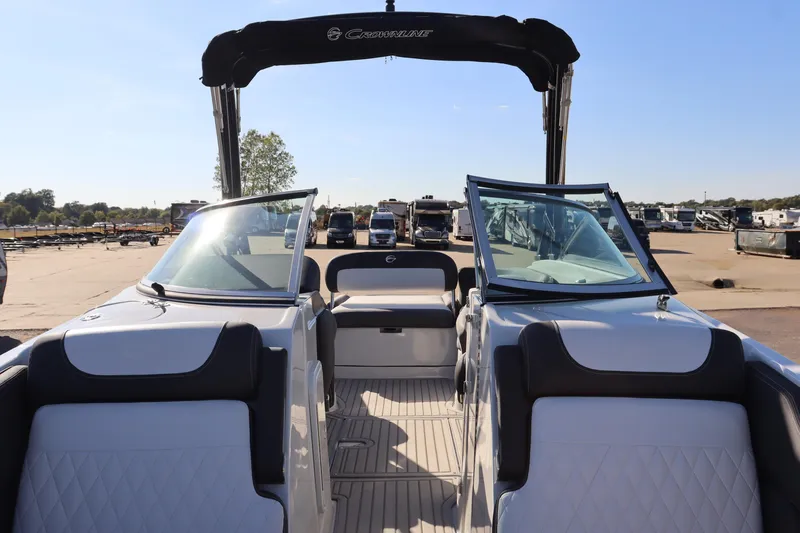 Slide: The Image of 2024 Crownline Eclipse E255 SURF boat storage with white Igloo cooler. - 16