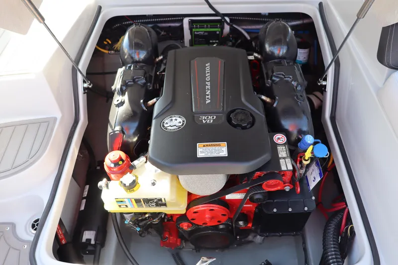 Slide: The Image of 2024 Crownline E255 Surf boat engine compartment with Volvo Penta V8 300 engine. - 22