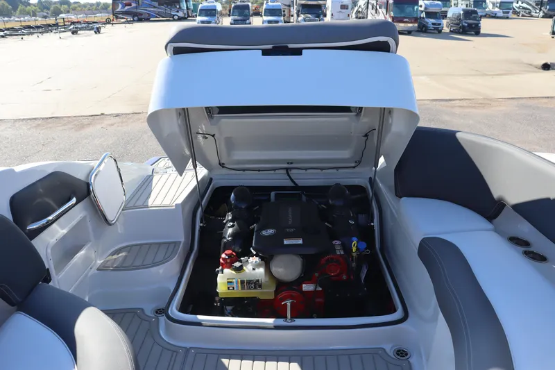 Slide: The Image of 2024 Crownline Eclipse E255 SURF boat interior with modern seating and blue LED lighting. - 3