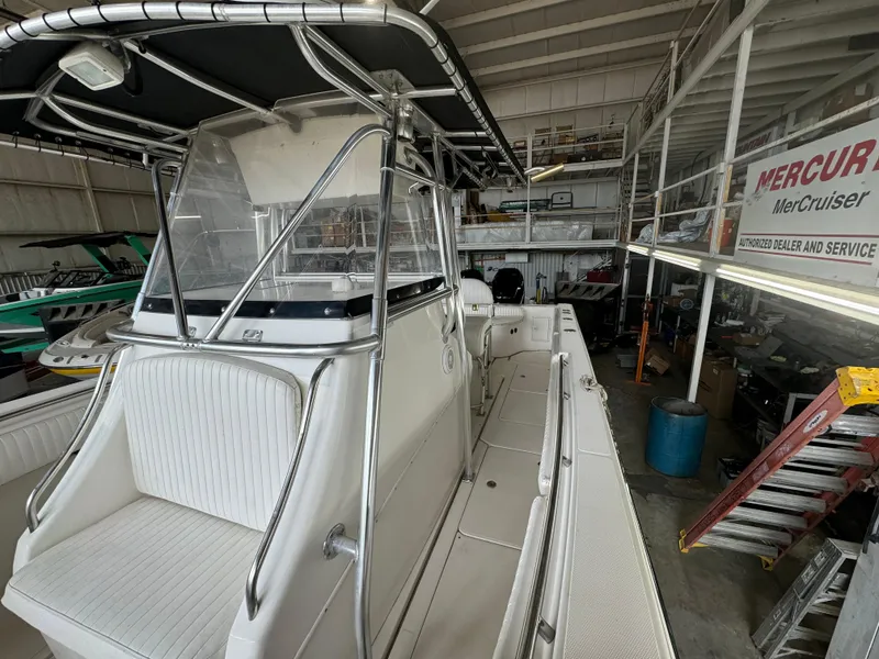Slide: The Image of 2007 Fountain 32 CC boat in a workshop, featuring a sleek design and spacious deck. - 15