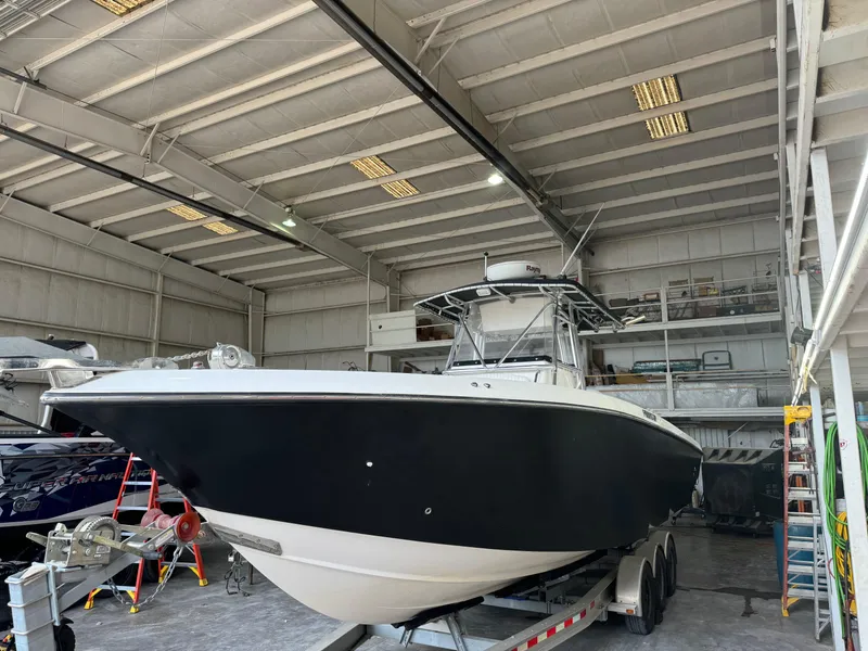Slide: The Image of 2007 Fountain 32 CC boat in a spacious indoor storage facility. - 4