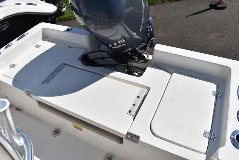 Slide: The Image of 2024 Key West 179 FS boat with outboard motor, rear deck view. - 13
