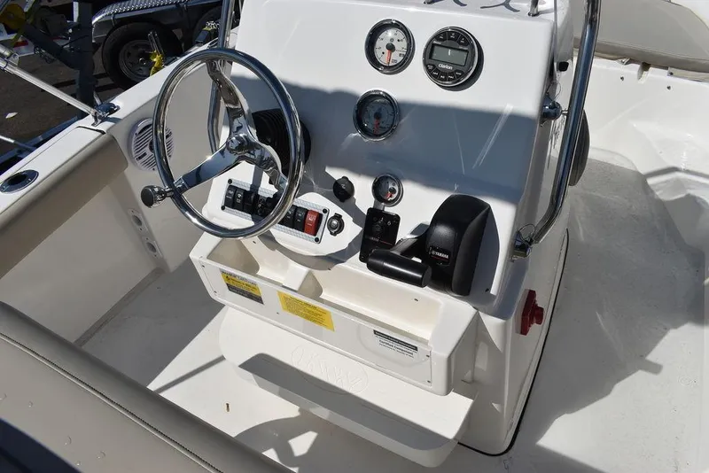 Slide: The Image of 2024 Key West 179 FS boat console with steering wheel and gauges. - 19