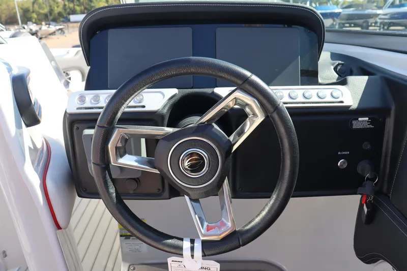 Slide: The Image of 2024 Crownline 260SS SURF boat steering wheel and dashboard. - 15