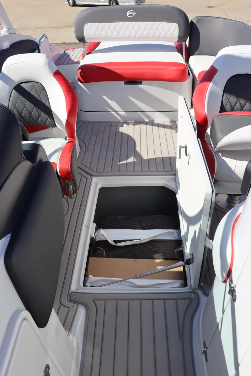 Slide: The Image of 2024 Crownline 260SS SURF boat interior with open storage compartment. - 20