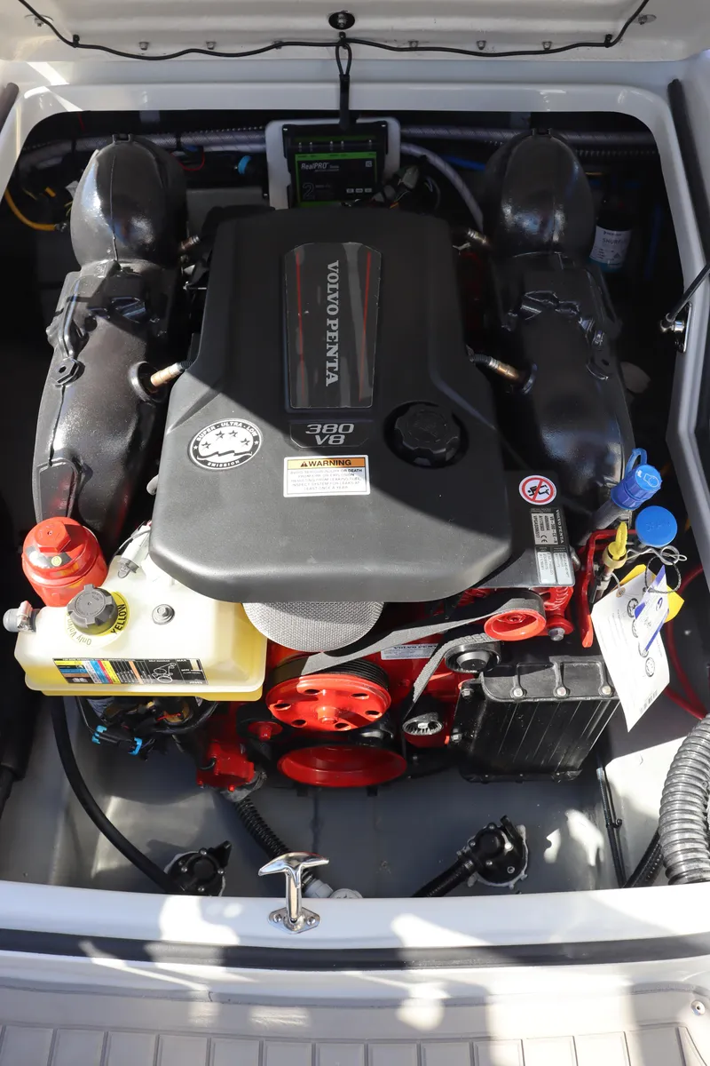 Slide: The Image of 2024 Crownline 260SS SURF boat engine compartment with Volvo Penta engine. - 24