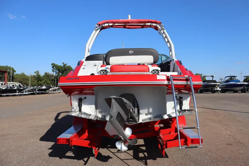 Slide: The Image of 2024 Crownline 260SS SURF boat, rear view with ladder and propeller. - 29