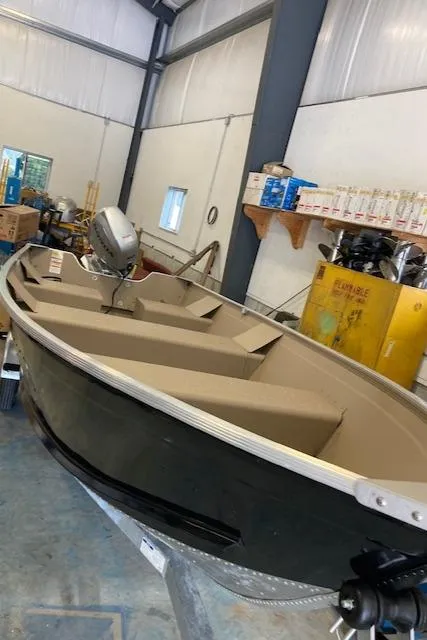 Slide: The Image of 2024 Polar Kraft Dakota 1670 boat in a storage facility. - 5