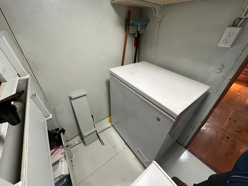 Slide: The Image of Utility room on a 2000 Bruce Roberts Ketch with a white chest freezer. - 26