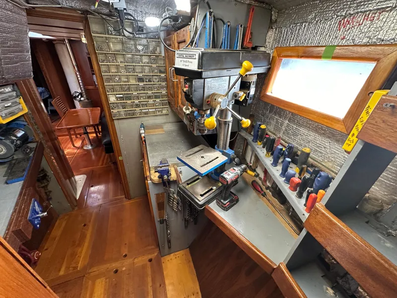 Slide: The Image of Interior of a 2000 Bruce Roberts Ketch with a well-equipped workshop. - 42