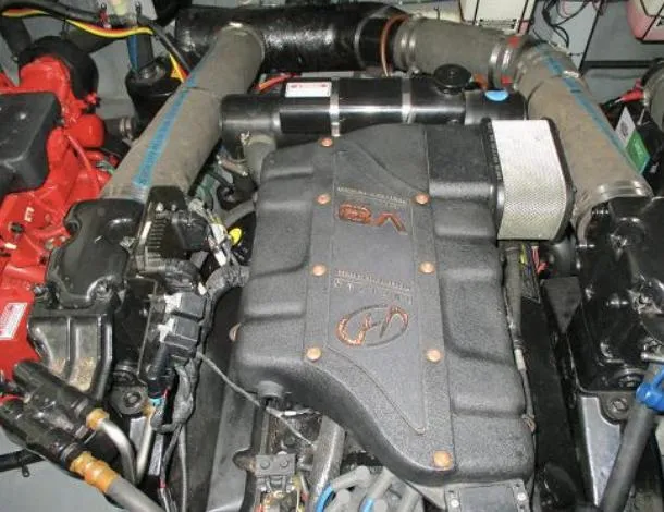 Slide: The Image of Engine of a 2001 Sea Ray 340 Sundancer boat, showcasing mechanical components. - 18