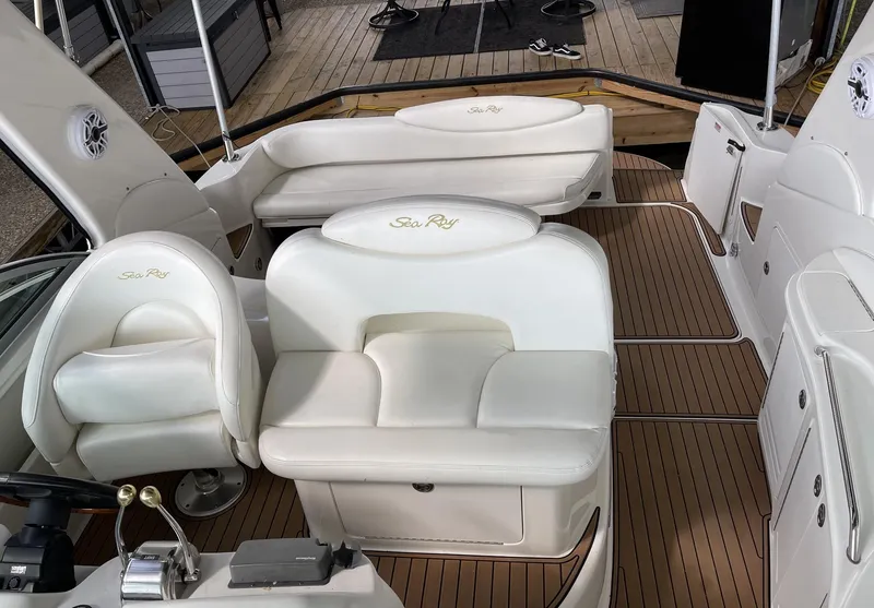 Slide: The Image of 2001 Sea Ray 340 Sundancer interior with white seating and teak flooring. - 7