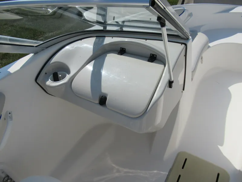 Slide: The Image of 2006 Glastron MX 195 boat interior with windshield and storage compartment. - 15