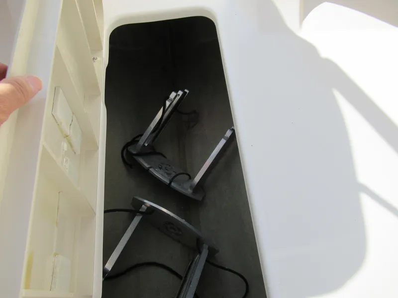 Slide: The Image of Storage compartment in a 2006 Glastron MX 195 boat with accessories inside. - 17