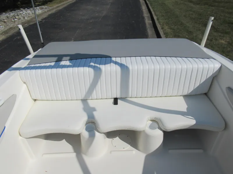 Slide: The Image of 2006 Glastron MX 195 boat interior with white cushioned seating. - 23