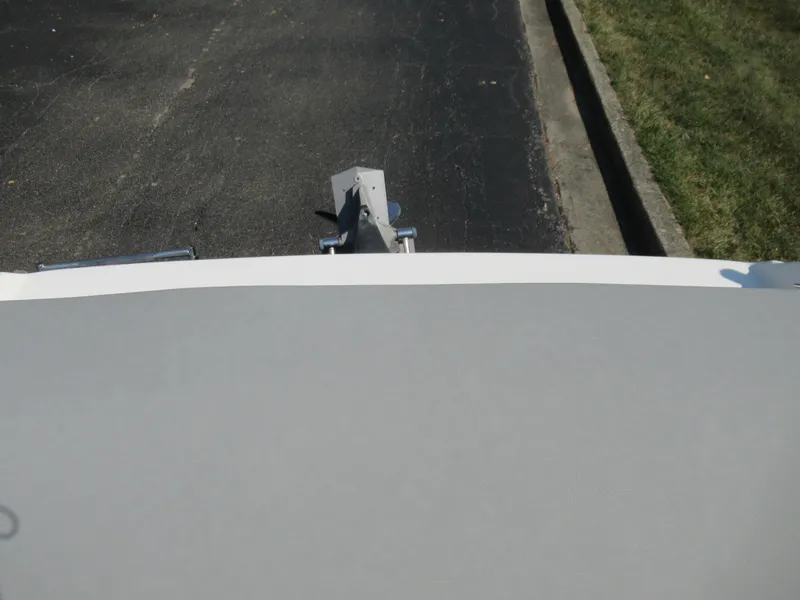 Slide: The Image of 2006 Glastron MX 195 boat trailer hitch on asphalt road. - 25