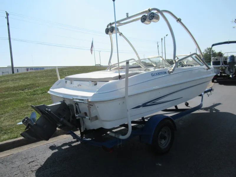 Slide: The Image of 2006 Glastron MX 195 boat on trailer, rear view, parked outdoors. - 4