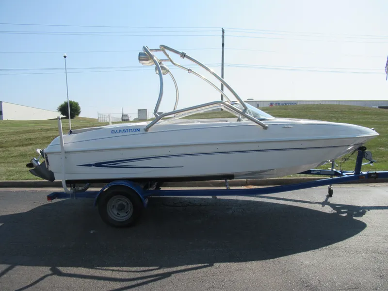 Slide: The Image of 2006 Glastron MX 195 boat on trailer, side view, outdoors. - 5