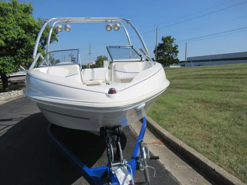 Slide: The Image of 2006 Glastron MX 195 boat on trailer, parked outdoors on sunny day. - 7