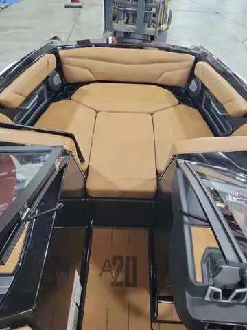 Slide: The Image of 2024 Axis Wake Research A20 boat interior with tan seating and sleek design. - 10