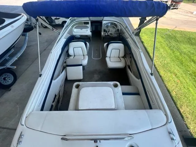 Slide: The Image of 1995 Bayliner 2050 Capri boat interior with seating and canopy, viewed from above. - 10