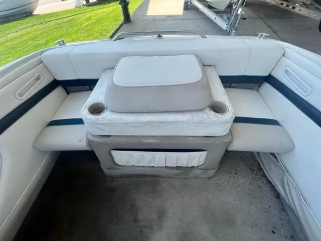 Slide: The Image of Interior seating of a 1995 Bayliner 2050 Capri boat with cup holders. - 12