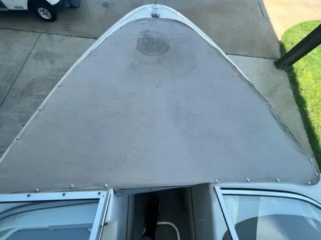 Slide: The Image of 1995 Bayliner 2050 Capri boat with covered bow, viewed from above. - 7